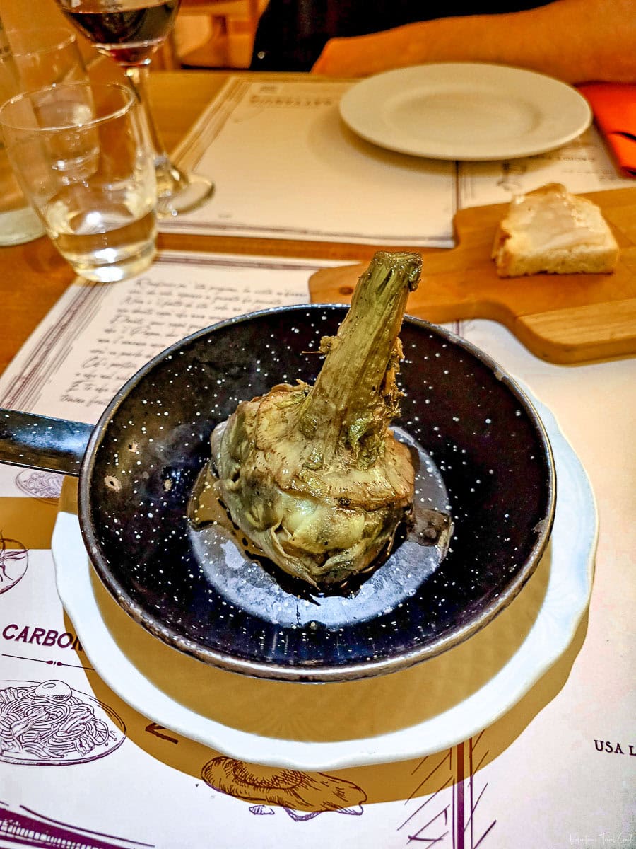 plate with a Roman artichoke which is unmissable in all of the best local restaurants in rome
